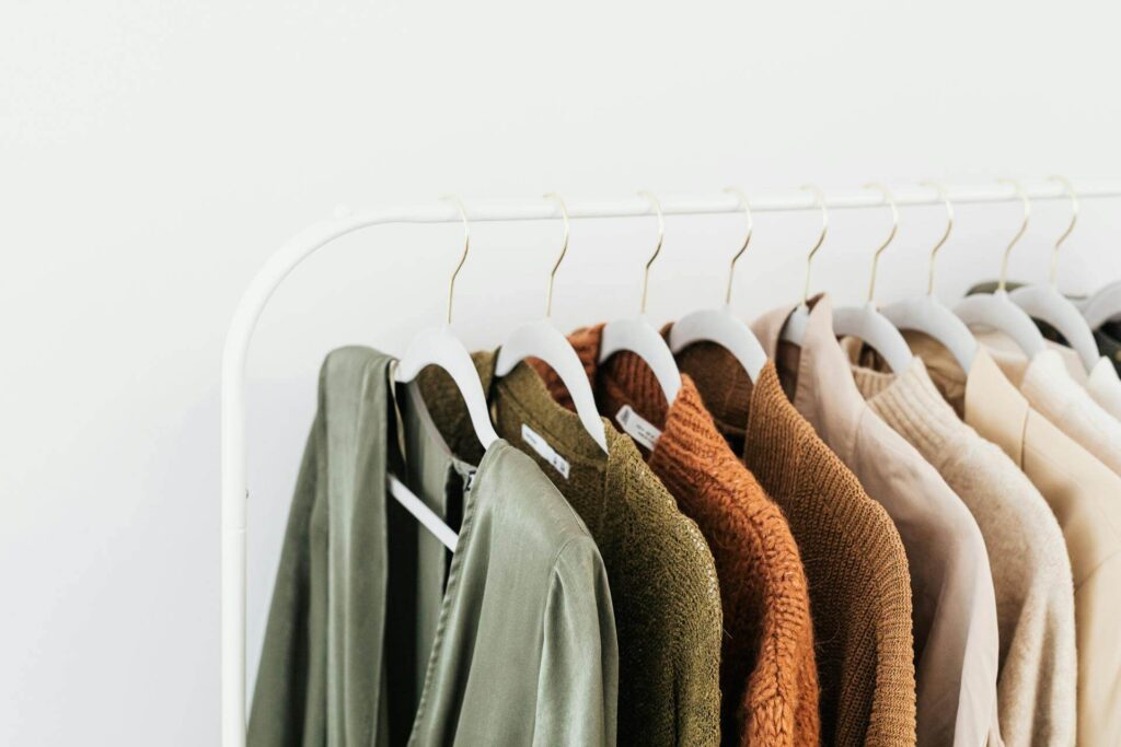 Rack dividers for organized apparel displays by Mark Bric Sizers in a retail store setting.
