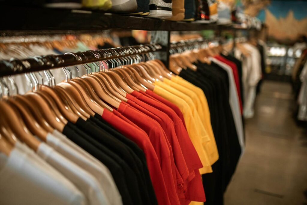 Premium size markers for hangers by Mark Bric Sizers improve apparel organization in retail stores.