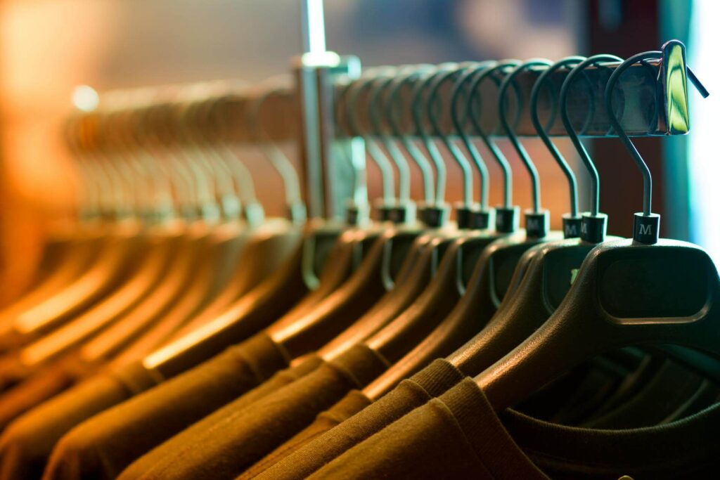 Size rings for clothes racks by Mark Bric Sizers enable efficient apparel organization and display.